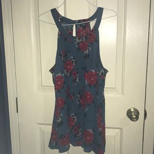 Blue blouse with red flowers